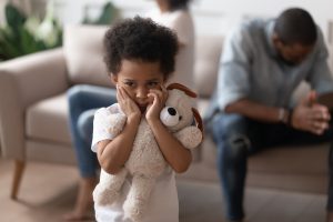 boy closed ears not to hear parents arguing